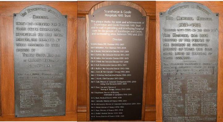 Three commemorative plaques listing the names of those involved in the heritage of Scunthorpe General Hospital.