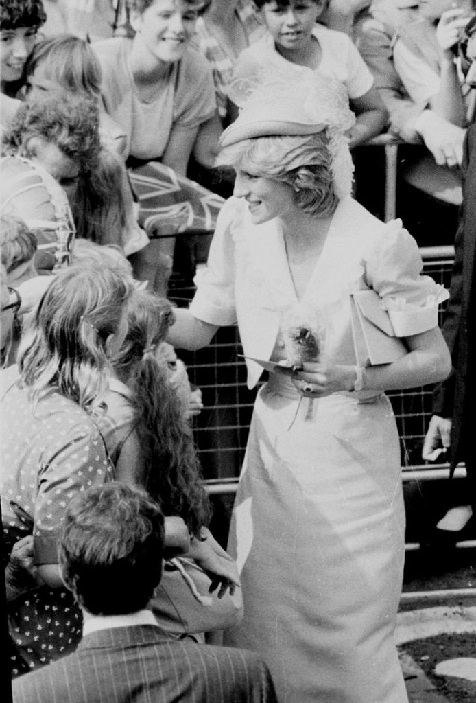 Princess Diana smiles at the children in the crowd