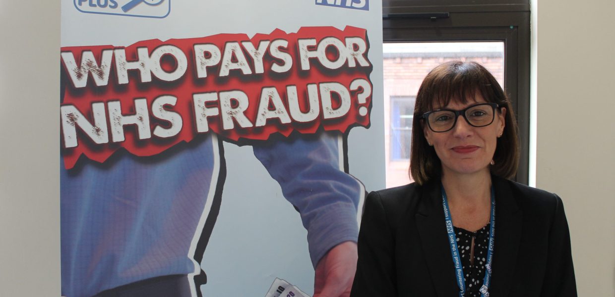 Nicki Foley, Local Counter Fraud Specialist, stands next to a banner which states 'Who pays for NHS fraud?'