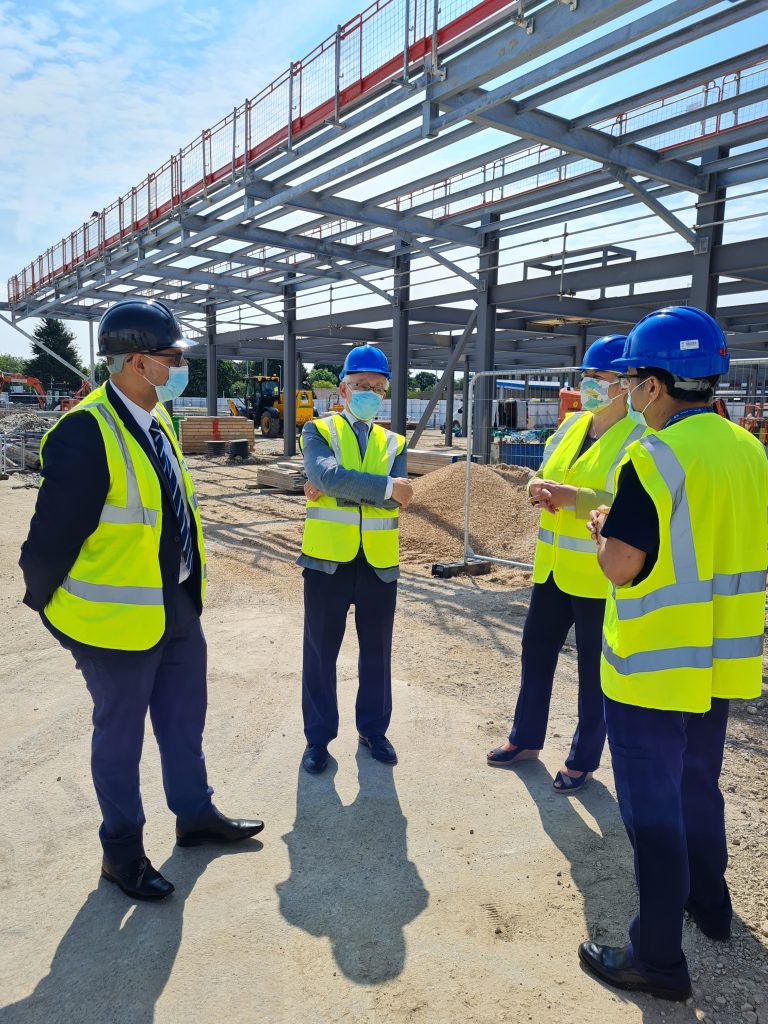 Director of Estates and Facilities Jug Johal and clinical lead Dr Anwer Qureshi show Grimsby MPs Martin Vickers and Lia Nici around the site