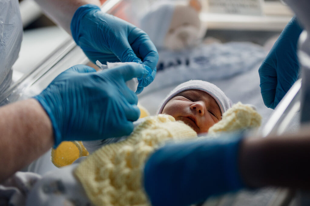 a baby in a cot