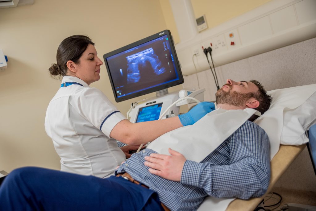 A man has an ultrasound scan 
