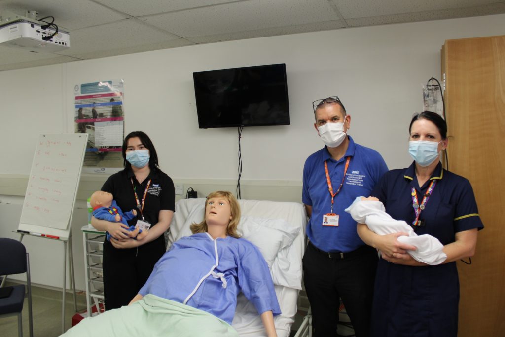 (From left to right): Shelly McGuffie, clinical simulation technician, Nick Harrison, clinical simulation lead and Emma Lancaster, advanced children’s nurse practitioner, pictured with Victoria and the baby manikin.