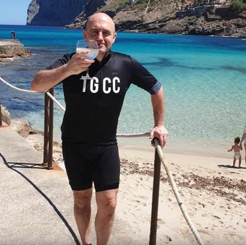 A man holding a drink on holiday