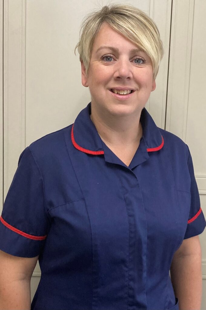 A woman in a nursing uniform