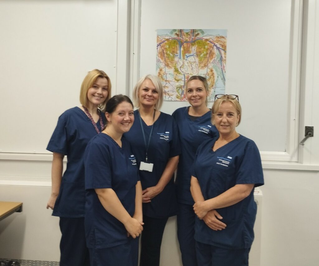 a group of staff wearing scrubs
