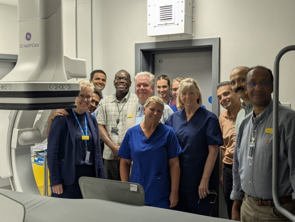 The team pose with the new Special Procedures scanner