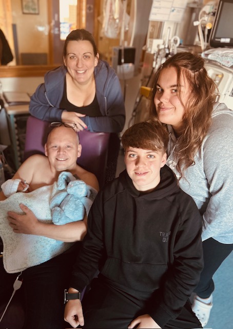 Theodore with his proud mum and dad, and siblings Lucy and Ellis