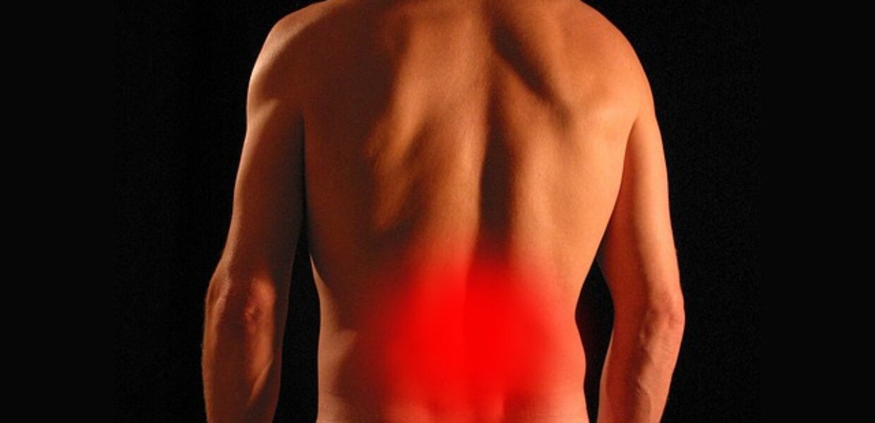 Image of a man's back with a red circle showing an area of pain