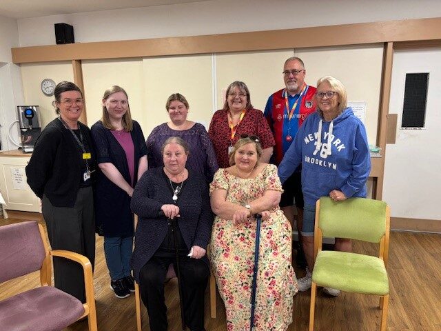 A man and a group of women