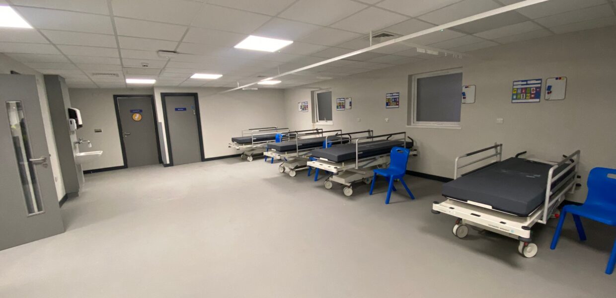 The interior of the one of the rooms, showing three trollies.