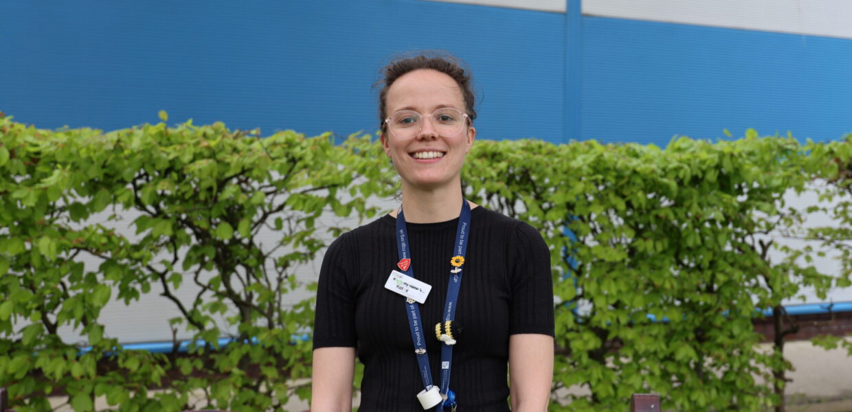 A woman stood outside smiling