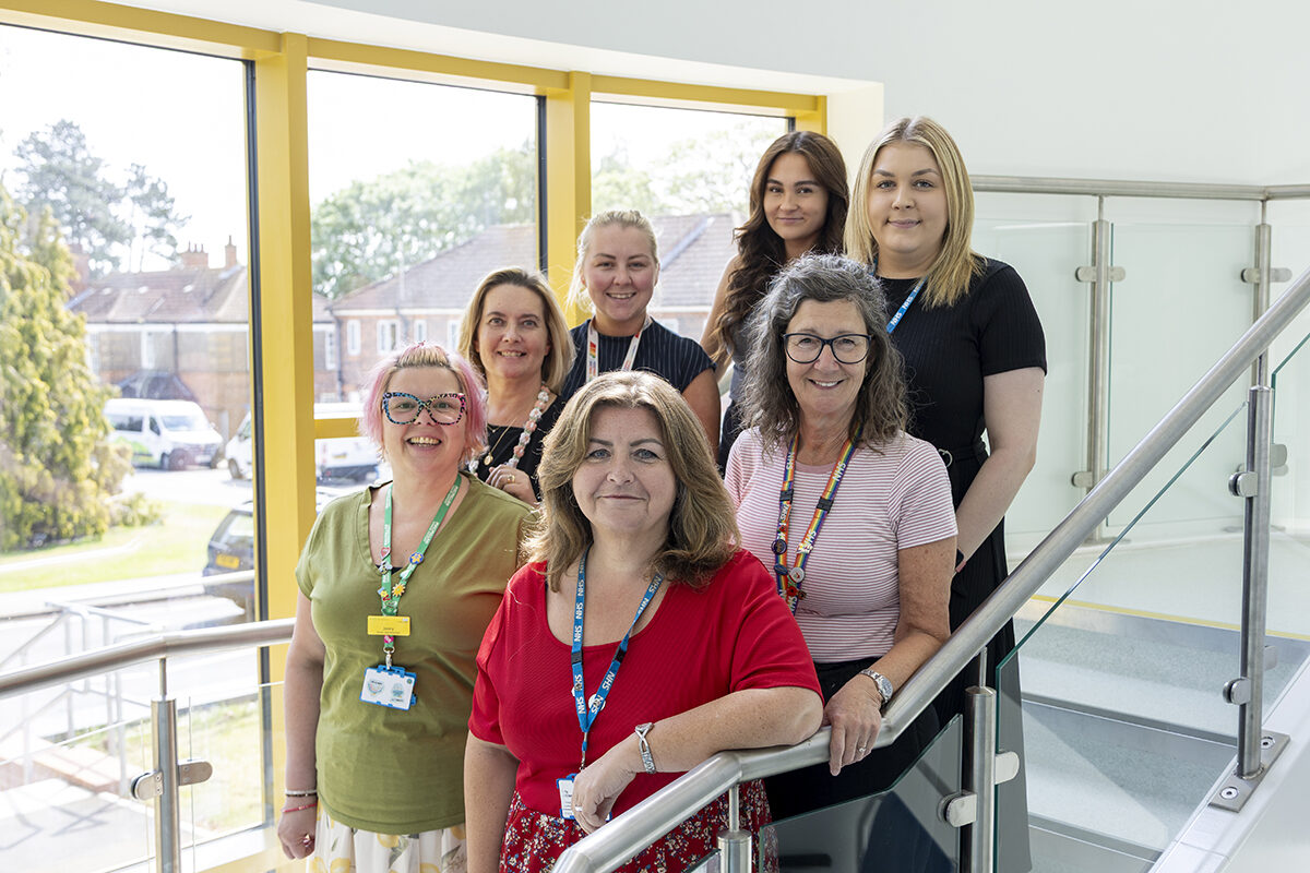 A group of hospital staff on a stairwell