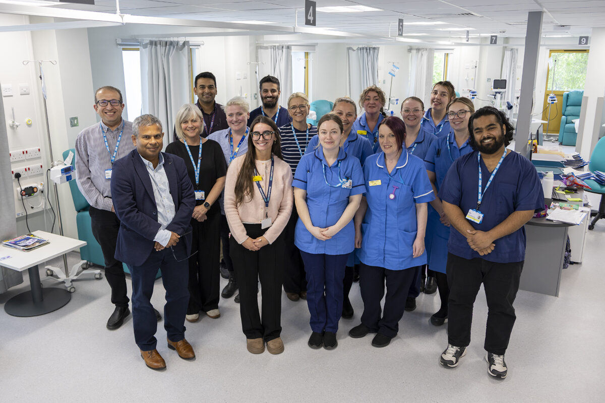 Members of the IBD Team standing in a clinic setting