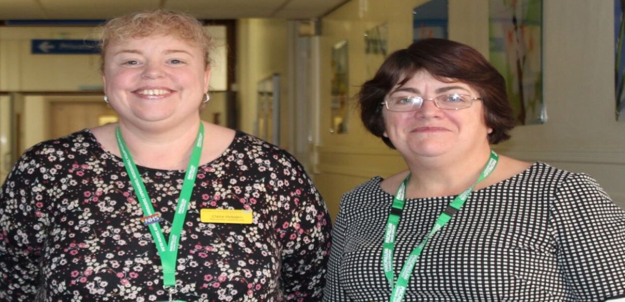 Two women - Claire Hebden and Julieann Woollas - standing side by side smiling.
