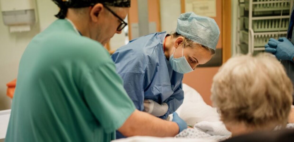 a consultant anaesthetist attends to a patient
