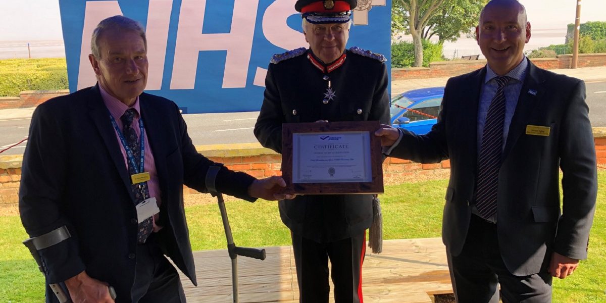 Northern Lincolnshire and Goole NHS Foundation Trust CEO Peter Reading (left) and the trusts’ Veteran’s Champion, Deputy Director of Estates and Facilities, Simon Tighe (right) receiving the award from Lord-Lieutenant Mr Toby Dennis.