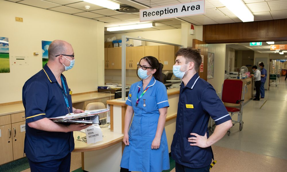 Clinical staff in conversation at Grimsby Hospital