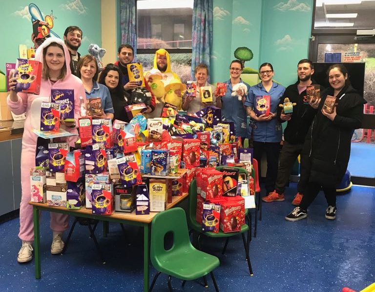 Scunny Bikers pictured with staff and Easter eggs on the Disney Ward